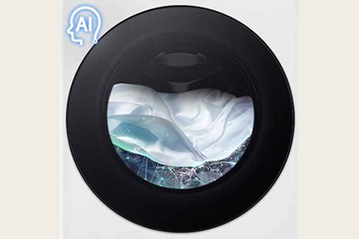 A white piece of cloth is shown in the drum of the washing machine front load washer being washed.