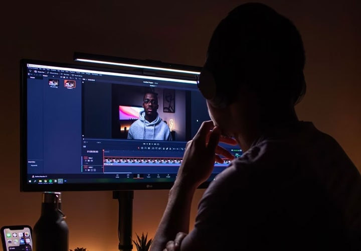 A man adjusts the brightness on his eye-friendly monitor