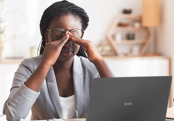 A woman rests her eyes to prevent eye strain