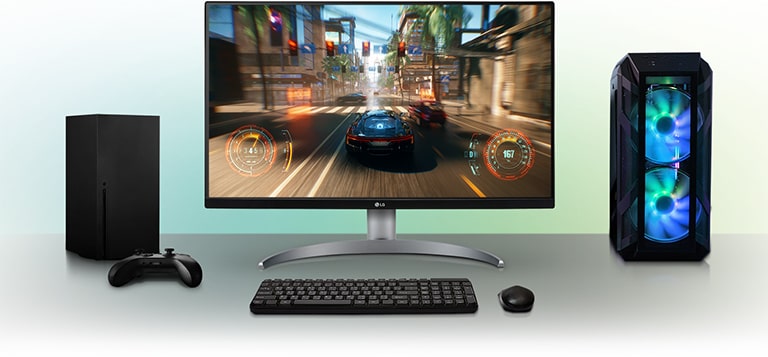 From left to right, Xbox Series X, LG UltraGear monitor and an LG speaker, all sat on a white desk