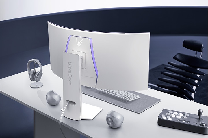White UltraGear monitor on a white desk in a modern office