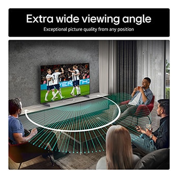 Living room space with a wall-mounted LG OLED TV. On the TV is a mountain range against a dark evening sky filled with stars. This scene is split in half. One side shows a duller, grayer version of the landscape labeled, Non Perfect Black display. On the other side is a more pleasing picture with a larger dynamic range of blacks and whites. 