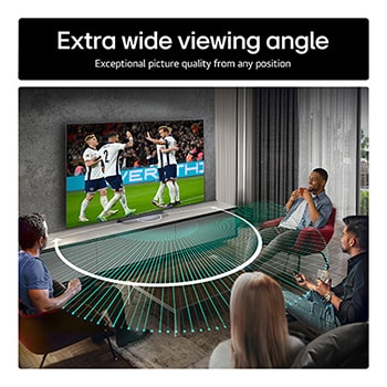 Living room space with a wall-mounted LG OLED TV. On the TV is a mountain range against a dark evening sky filled with stars. This scene is split in half. One side shows a duller, grayer version of the landscape labeled, Non Perfect Black display. On the other side is a more pleasing picture with a larger dynamic range of blacks and whites. 