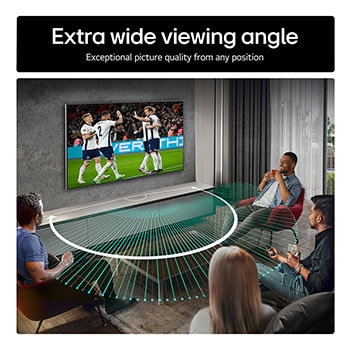 Living room space with a wall-mounted LG OLED TV. On the TV is a mountain range against a dark evening sky filled with stars. This scene is split in half. One side shows a duller, grayer version of the landscape labeled, Non Perfect Black display. On the other side is a more pleasing picture with a larger dynamic range of blacks and whites. 