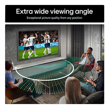 Living room space with a wall-mounted LG OLED TV. On the TV is a mountain range against a dark evening sky filled with stars. This scene is split in half. One side shows a duller, grayer version of the landscape labeled, Non Perfect Black display. On the other side is a more pleasing picture with a larger dynamic range of blacks and whites. 