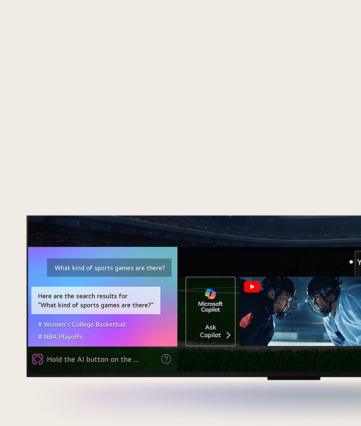 Màn hình TV LG QNED hi?n th? cách AI Search ho?t ??ng. M?t c?a s? chat nh? m? ra, cho th?y ng??i dùng ??t cau h?i v? các tr?n ??u th? thao có s?n. AI Search ph?n h?i qua cu?c trò chuy?n và hi?n th? hình thu nh? c?a các n?i dung phù h?p. ??ng th?i, trên màn hình c?ng xu?t hi?n g?i y ??t cau h?i cho Microsoft Copilot.