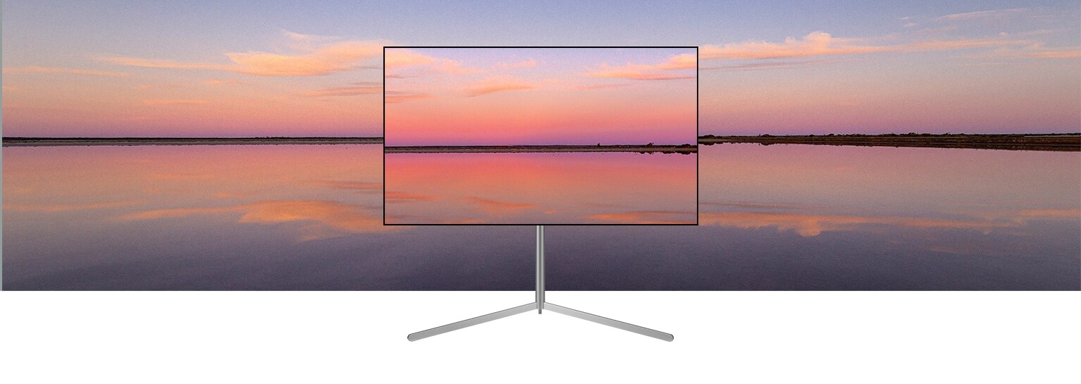 Telewizor OLED LG znajduje si? w nowoczesnym szarym wn?trzu naprzeciwko okna wychodz?cego na basen. Telewizor OLED LG znajduje si? w neutralnie urz?dzonym wn?trzu z widocznymi ceg?ami, drewnianymi detalami i zieleni?.