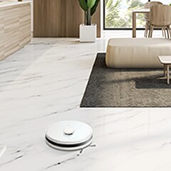 There is an LG CordZero? placed on the floor of the living room, among the arranged furniture.
