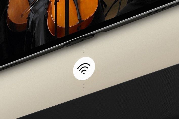 G?rüntüde LG OLED TV ile Soundbar ve ortada beyaz bir Wi-Fi sembolü grafi?i yer al?yor.
