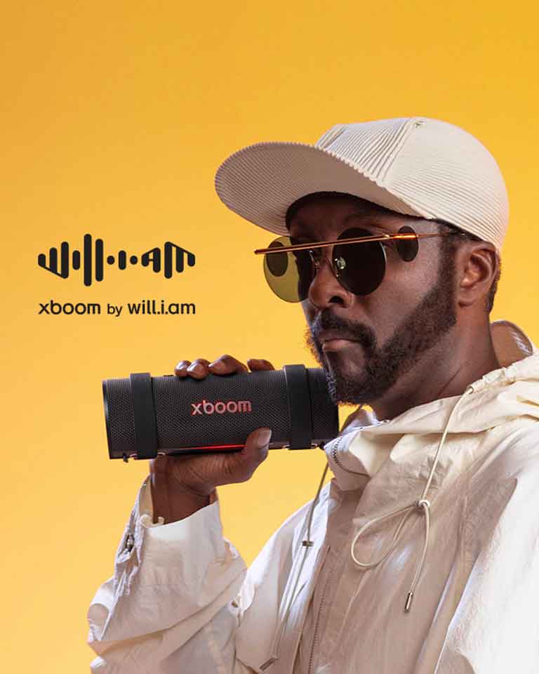 will.i.am in white outfit is holding xboom Grab.	