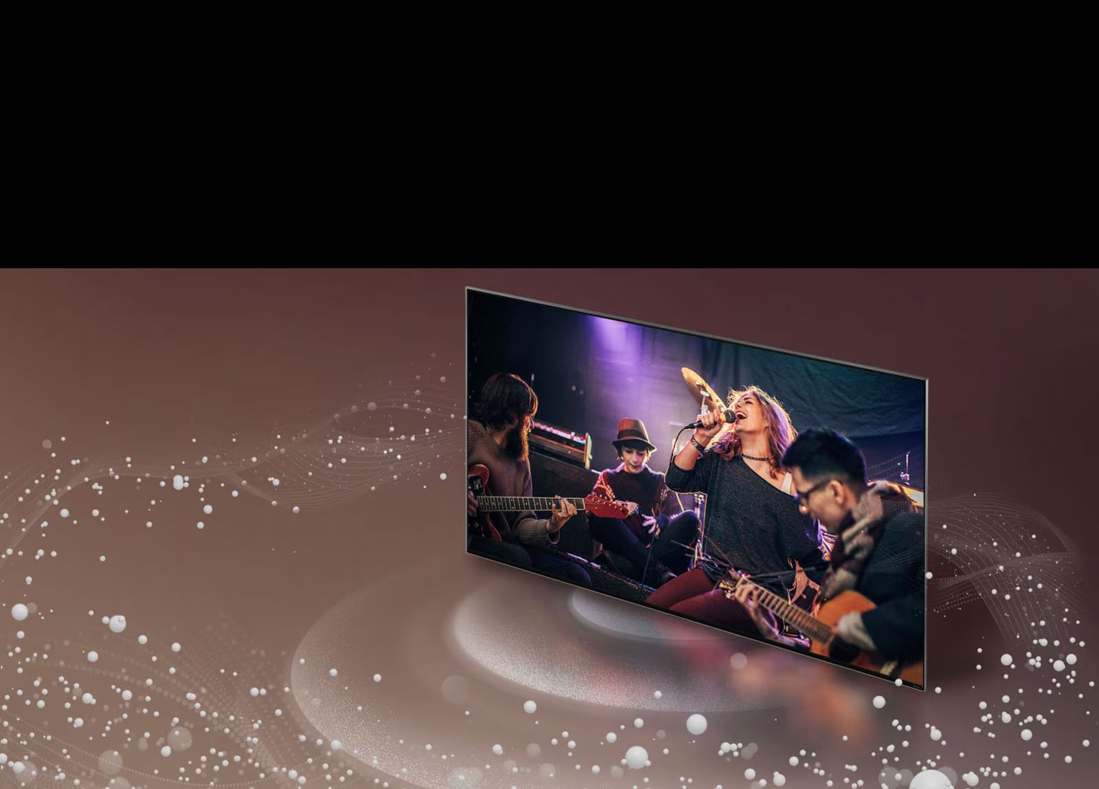 Uma imagem de bolhas e ondas sonoras saindo da tela de uma TV da LG e preenchendo o espa?o.