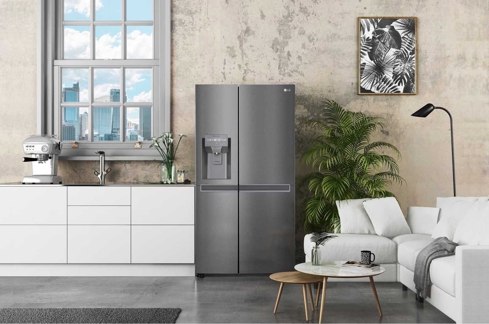 Cuisine moderne avec un réfrigérateur LG gris métallisé à deux portes, une machine à café élégante sur un plan de travail blanc et un salon attenant décoré avec des plantes et un canapé blanc confortable.