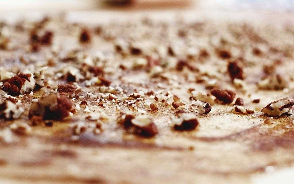 Pecans are sprinkled on pumpkin spiced cinnamon rolls, as they get ready to be baked in the NeoChef Countertop Microwave Oven