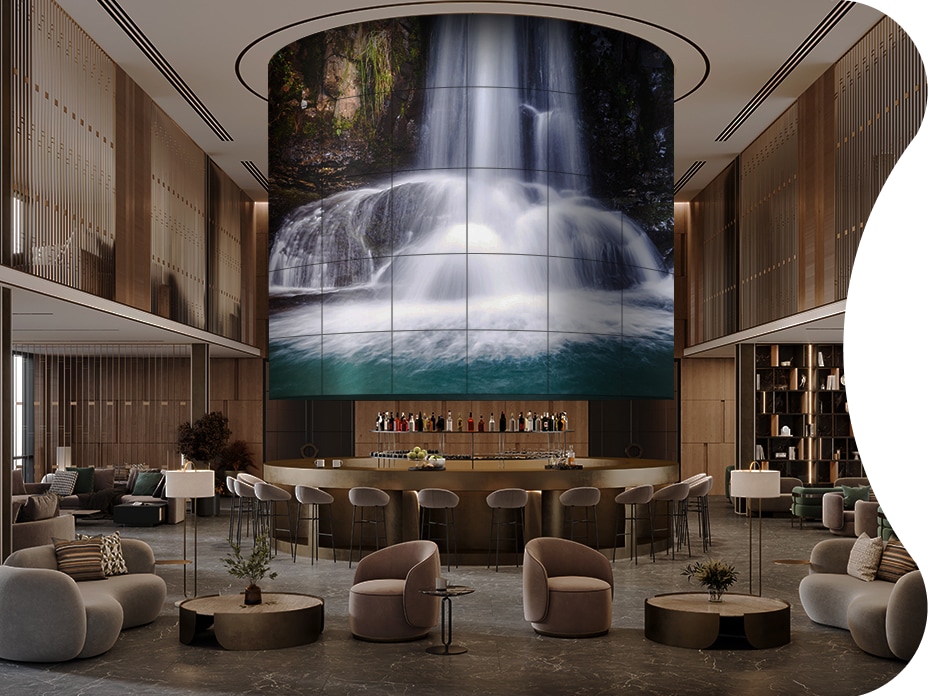 A Flexible Curved Open Frame OLED Signage fills the hotel ballroom at a magnificent scale. 