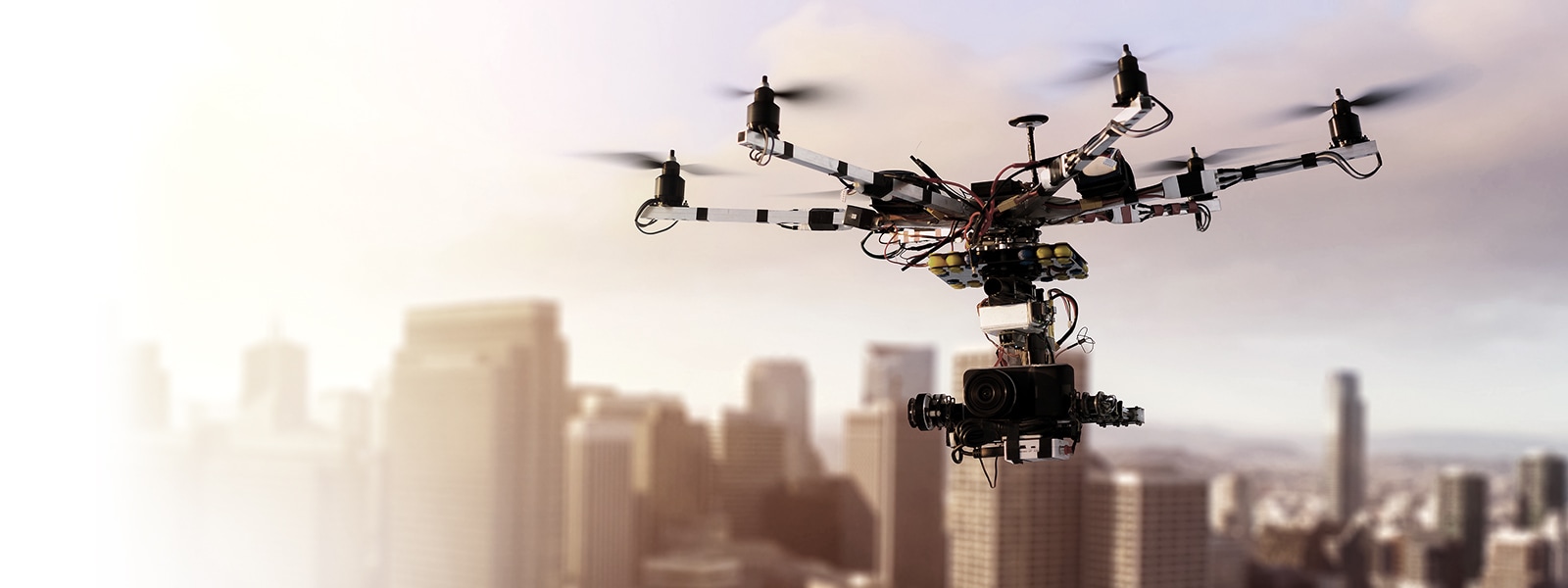 This is an image of a drone flying in the city sky