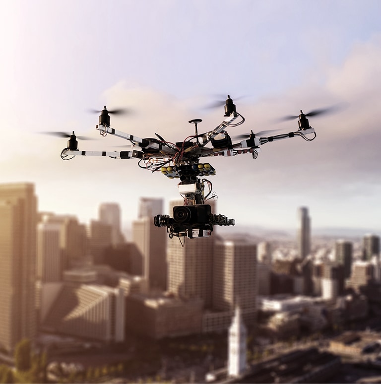 This is an image of a drone flying in the city sky