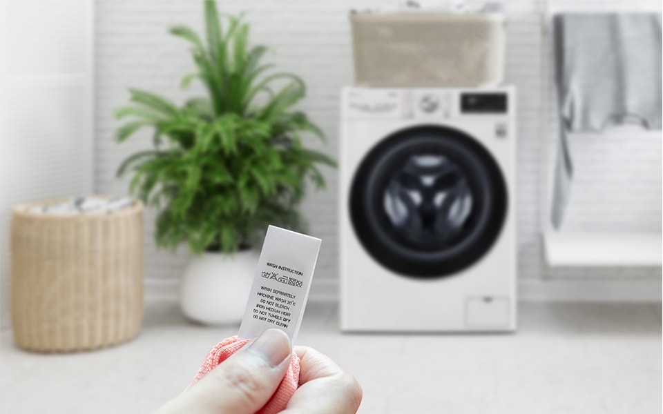 Washer Cycles picture checking the care label.jpg