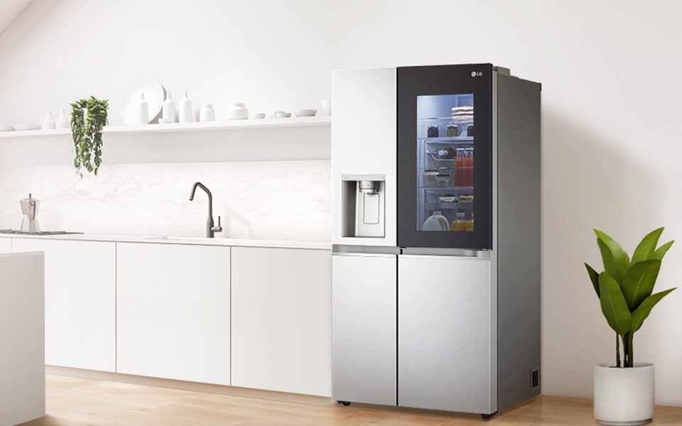 A stainless steel LG InstaView? ThinQ? smart refrigerator in a modern plant-filled kitchen 