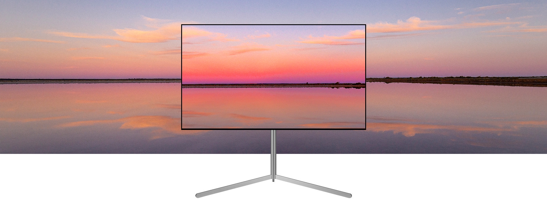 Μια τηλε?ραση LG OLED π?νω σε μια β?ση Gallery, απεικον?ζει ?να μπλε και ροζ ηλιοβασ?λεμα που συνδυ?ζεται με το φ?ντο