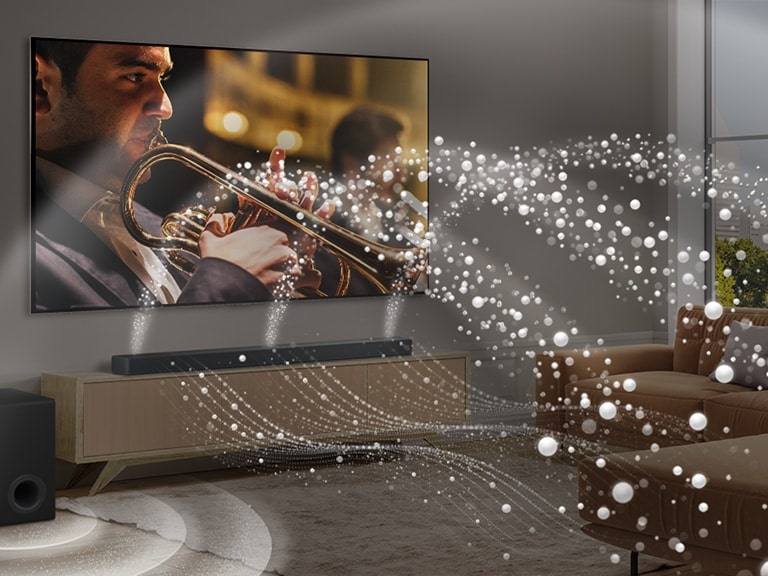  LG Soundbar, LG TV i niskofrekventni zvu?nik (subwoofer) u modernom gradskom stanu. LG Soundbar emitira tri zvu?na vala, sa?injena od bijelih kapljica koje lebde du? dna poda. Vi?e bijelih kapljica zvu?nih valova izlazi prema gore s vrha soundbara. Pored Soundbar-a je niskofrekventni zvu?nik (subwoofer) koji stvara zvu?ni efekt odozdo. Kao cjelina, stvaraju efekt kupole u cijeloj prostoriji.