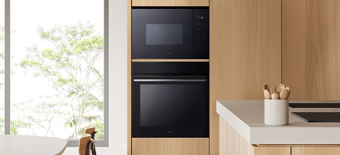 The kictchen with installation of microwave oven.