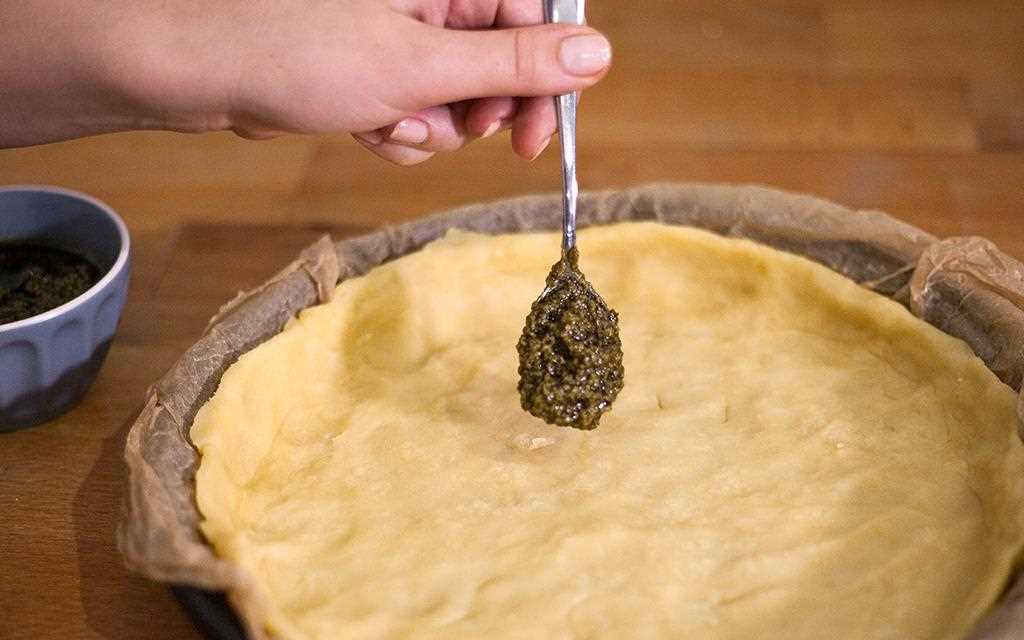 LG's chef adds pesto to the dough while making a Tomato Quiche, all in the NeoChef microwave | More at LG MAGAZINE