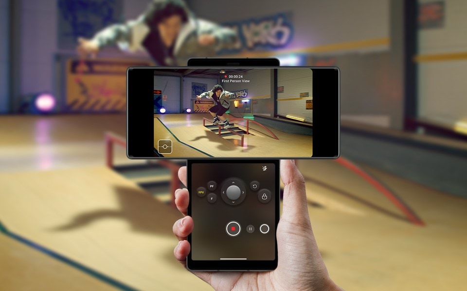 A person using the gimbal motion camera feature on the LG WING to record a man skateboarding