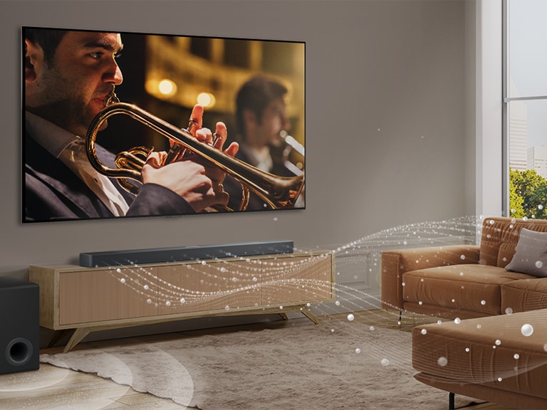 O bar? de sunet LG, un televizor LG ?i un subwoofer sunt ?ntr-un apartament modern dintr-un ora?. Bara de sunet LG emite trei ramuri de unde sonore, formate din pic?turi albe care plutesc de-a lungul podelei. Lang? bar? se afl? un subwoofer, care genereaz? un efect sonor din partea de jos.