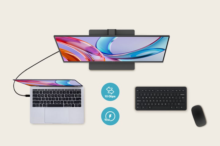 Pogled odozgo na monitor priklju?en na laptop, s tastaturom i mi?em ispod.	