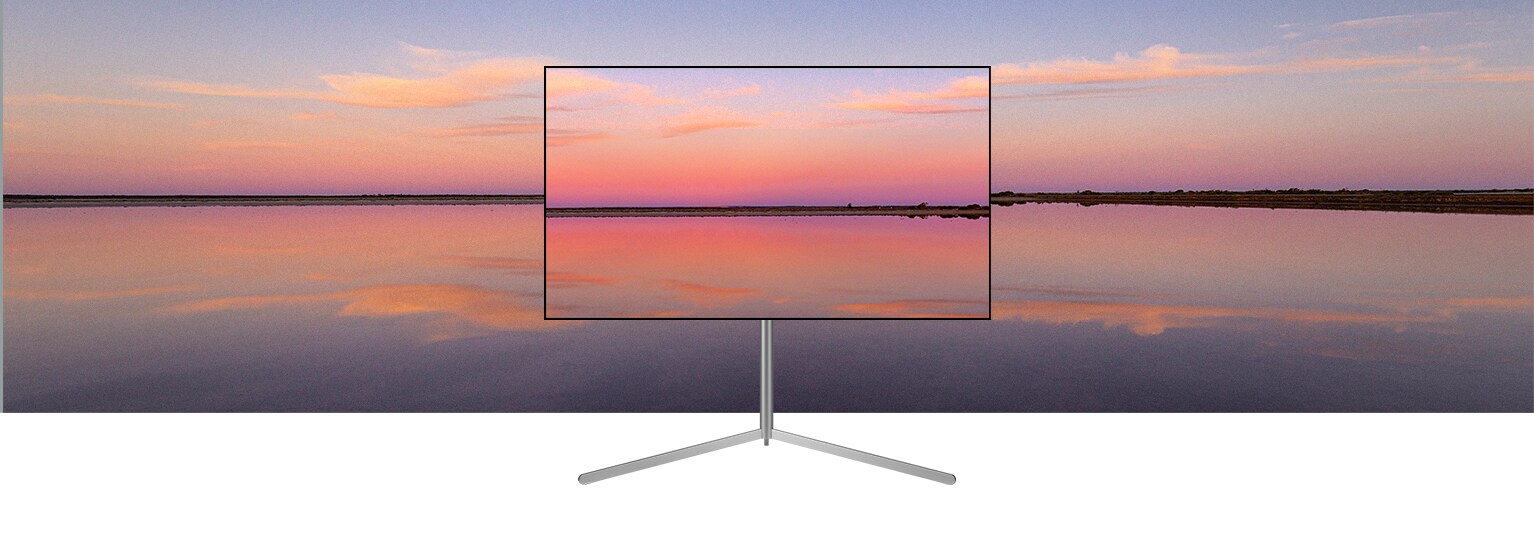 OLED televízor LG na stojane Gallery zobrazuje modro-ru?ovy západ slnka, ktory splyva s pozadím