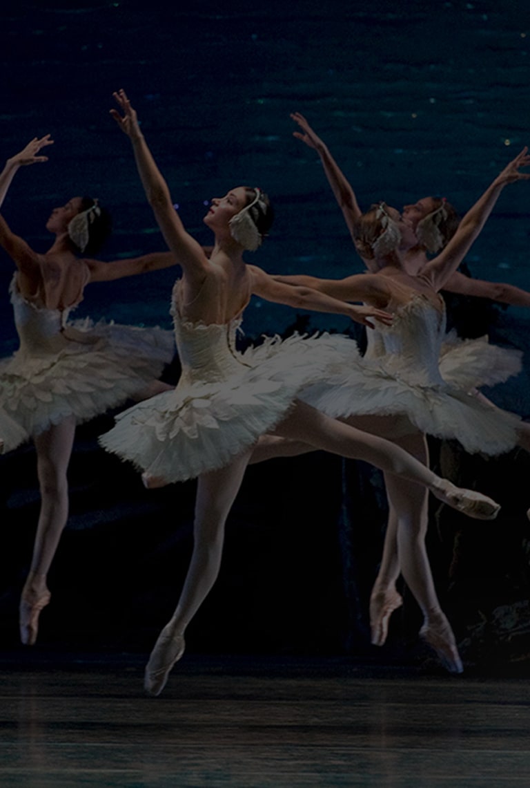 An woman is dancing ballet on the stage